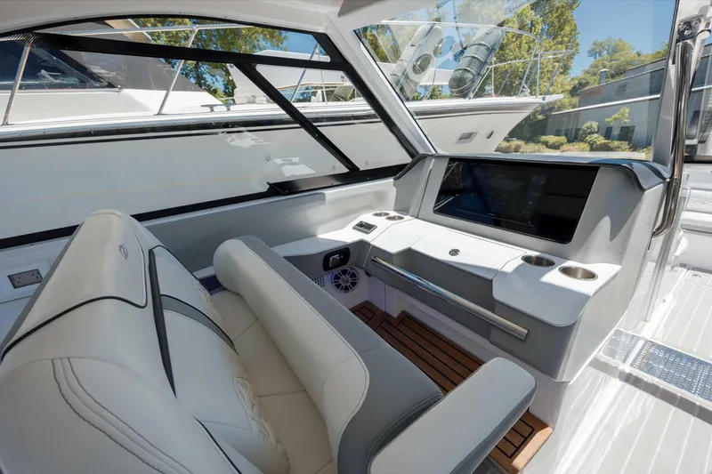  Yacht Photos Pics 2022 Regal LX36 boat interior with modern dashboard and seating.