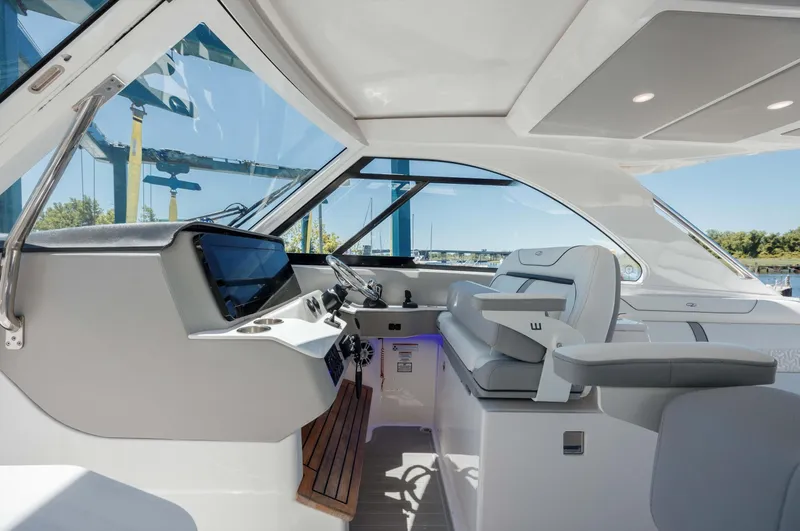  Yacht Photos Pics 2022 Regal LX36 boat interior with modern helm, sleek design, and panoramic windows.