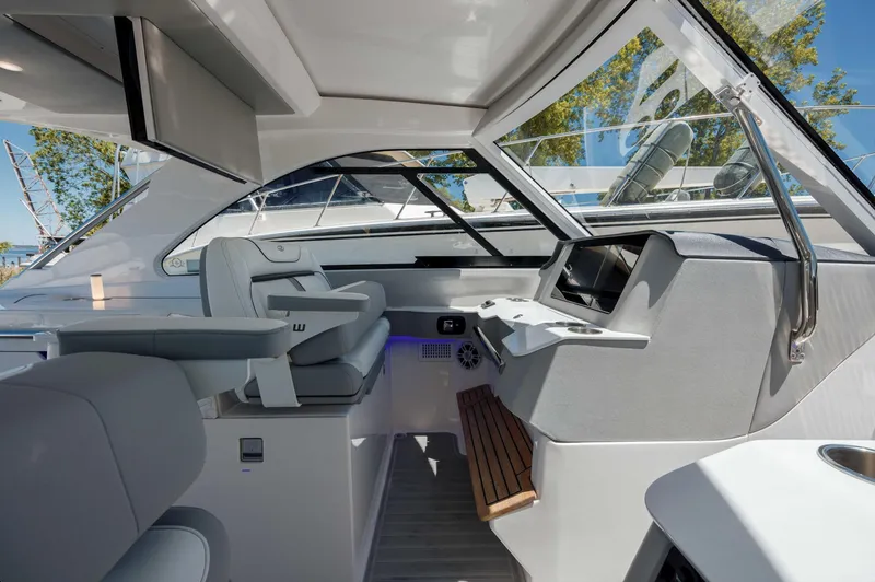  Yacht Photos Pics 2022 Regal LX36 boat interior with modern helm and seating, featuring sleek design and large windows.