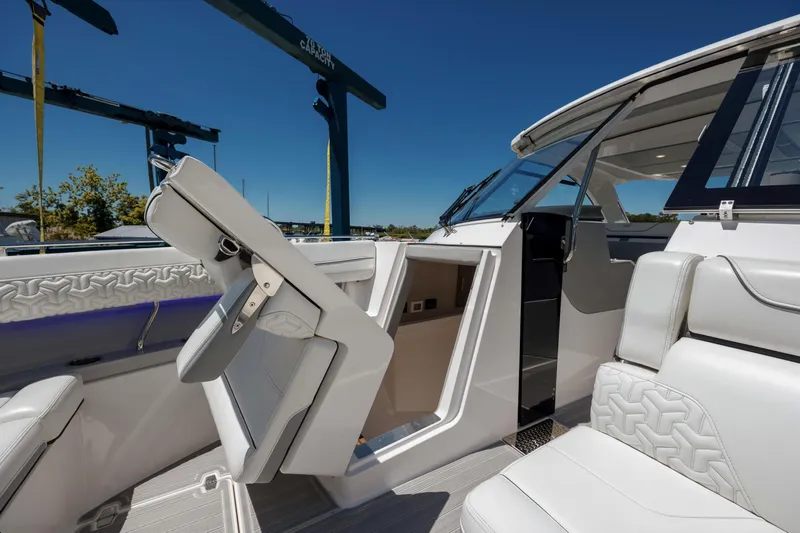  Yacht Photos Pics 2022 Regal LX36 boat interior with modern seating and sleek design.