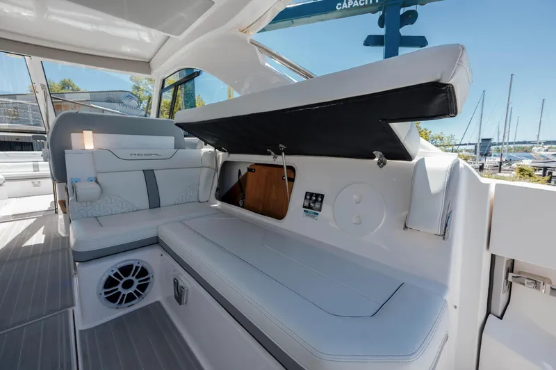  Yacht Photos Pics 2022 Regal LX36 boat interior with seating, storage, and speaker.
