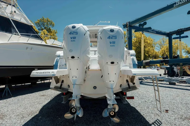  Yacht Photos Pics 2022 Regal LX36 boat with twin 425 V8 engines, parked in a marina.