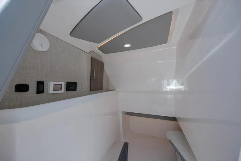  Yacht Photos Pics Interior cabin of 2022 Regal LX36 boat, featuring modern design and control panels.