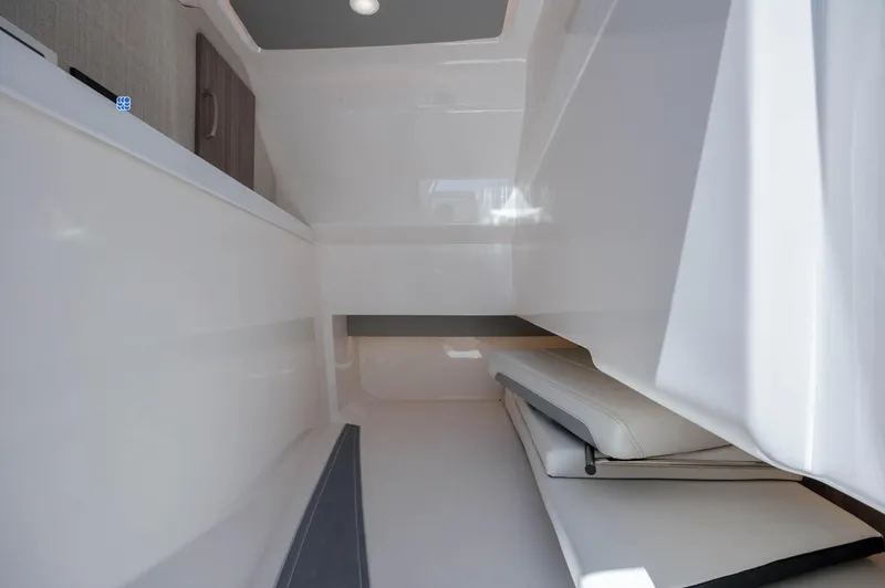  Yacht Photos Pics Interior cabin of 2022 Regal LX36 boat, featuring sleek white design and modern amenities.