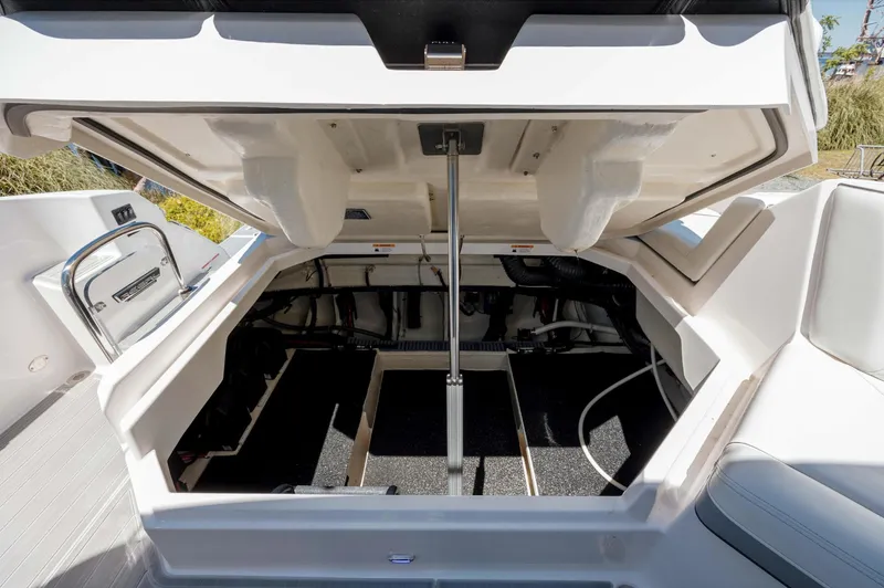  Yacht Photos Pics 2022 Regal LX36 boat storage compartment open, showcasing spacious interior design.
