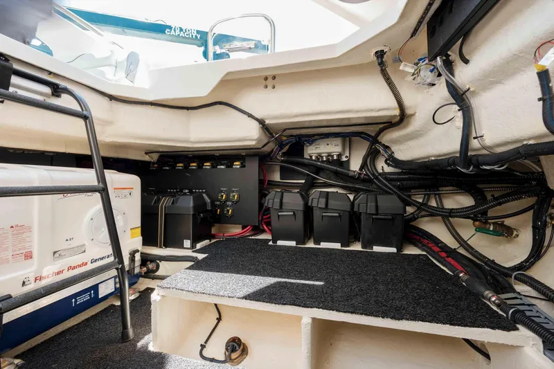  Yacht Photos Pics 2022 Regal LX36 boat interior showing battery compartment and wiring setup.