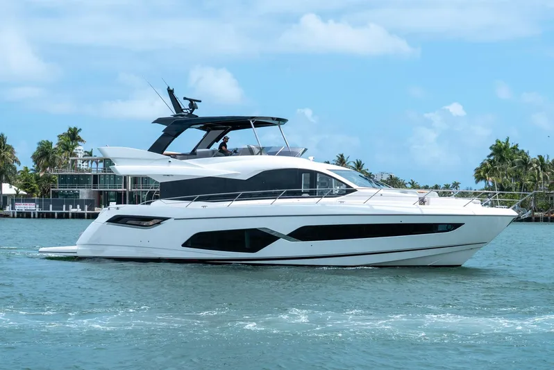  Yacht Photos Pics 2024 Sunseeker Manhattan 68 yacht cruising on a sunny day.