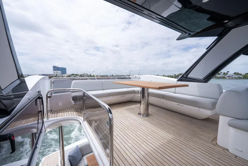  Yacht Photos Pics 2024 Sunseeker Manhattan 68 yacht deck with elegant seating and table.