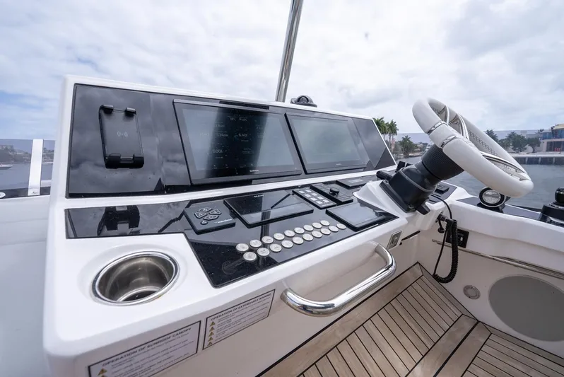  Yacht Photos Pics 2024 Sunseeker Manhattan 68 yacht helm with modern controls and steering wheel.