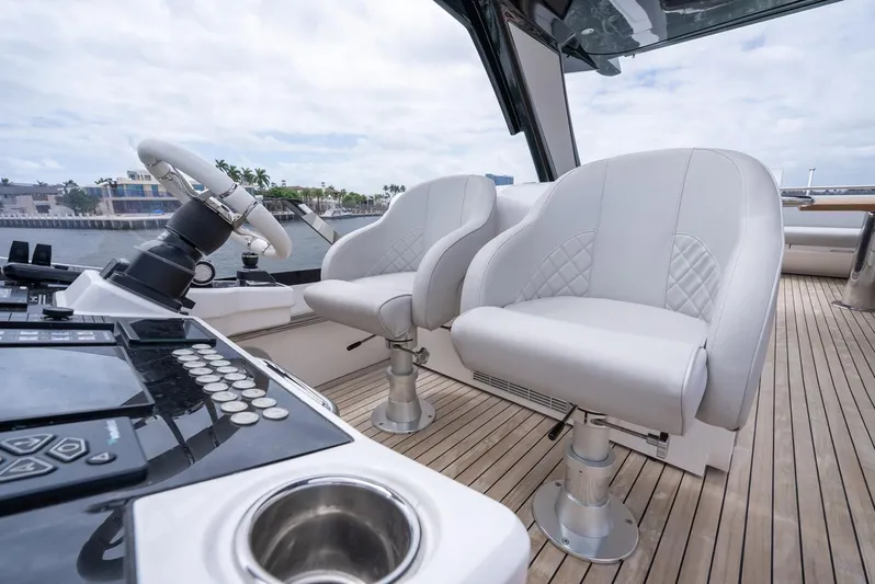  Yacht Photos Pics 2024 Sunseeker Manhattan 68 yacht cockpit with modern helm and luxurious seating.