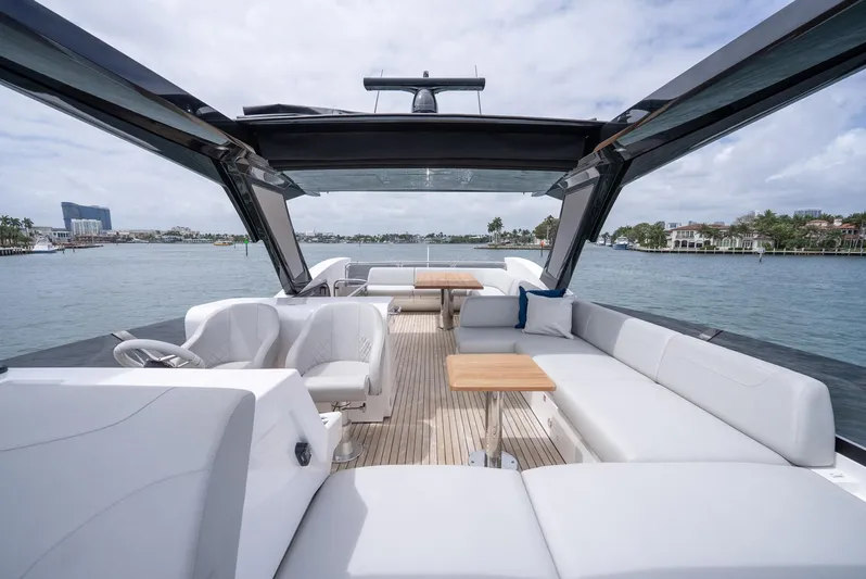  Yacht Photos Pics Luxurious 2024 Sunseeker Manhattan 68 yacht interior with elegant seating and scenic water views.