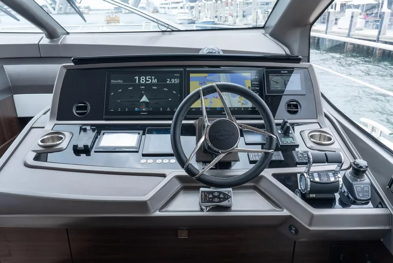  Yacht Photos Pics 2024 Sunseeker Manhattan 68 yacht helm with advanced navigation controls and sleek design.