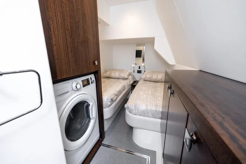  Yacht Photos Pics 2024 Sunseeker Manhattan 68 interior with twin beds and washing machine.