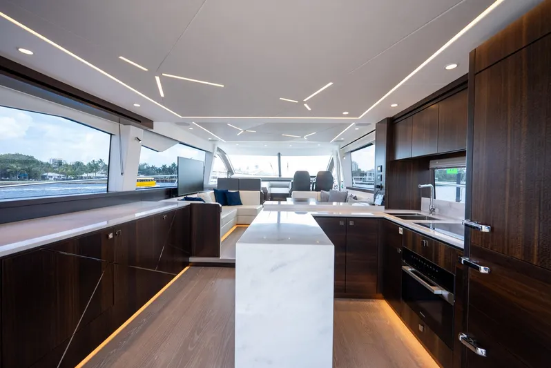  Yacht Photos Pics Luxurious interior of 2024 Sunseeker Manhattan 68 yacht with modern kitchen design.