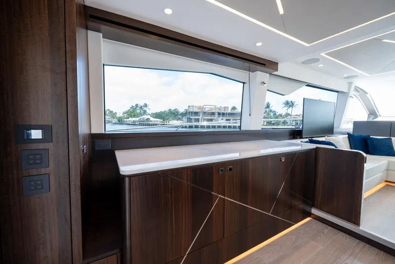  Yacht Photos Pics Luxurious interior of 2024 Sunseeker Manhattan 68 yacht with sleek wood finishes.