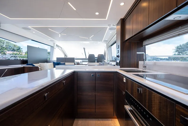  Yacht Photos Pics Luxurious interior of 2024 Sunseeker Manhattan 68 yacht with modern kitchen design.