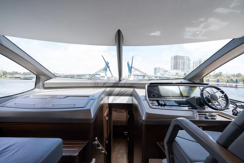  Yacht Photos Pics 2024 Sunseeker Manhattan 68 yacht cockpit with modern navigation controls and panoramic windows.