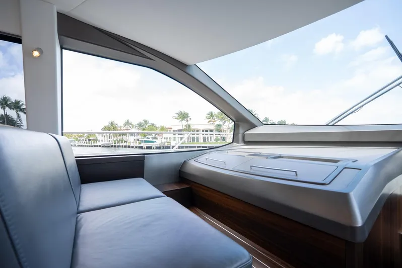  Yacht Photos Pics Interior view of 2024 Sunseeker Manhattan 68 yacht, featuring sleek seating and large windows.