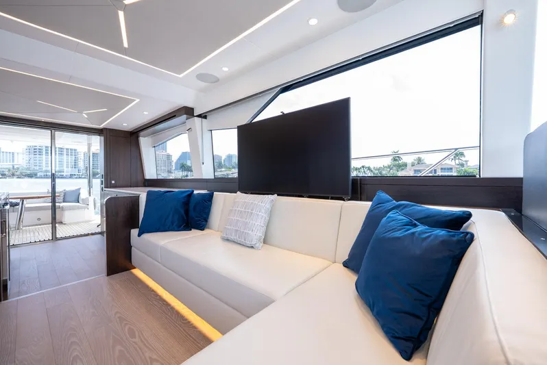  Yacht Photos Pics Luxurious interior of 2024 Sunseeker Manhattan 68 yacht with modern seating and large windows.