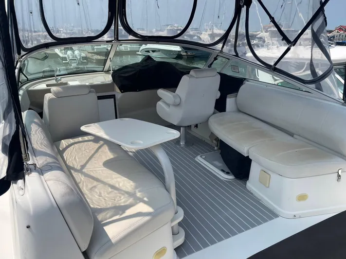 Andiamo Freedom Yacht Photos Pics 2006 Carver 36 Mariner yacht interior with white seating and table, docked at marina.