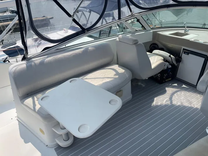 Andiamo Freedom Yacht Photos Pics 2006 Carver 36 Mariner interior with seating, table, and helm station.