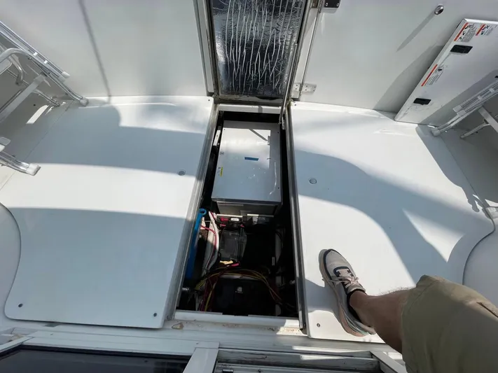 Andiamo Freedom Yacht Photos Pics 2006 Carver 36 Mariner engine compartment with open hatch, showing mechanical components.