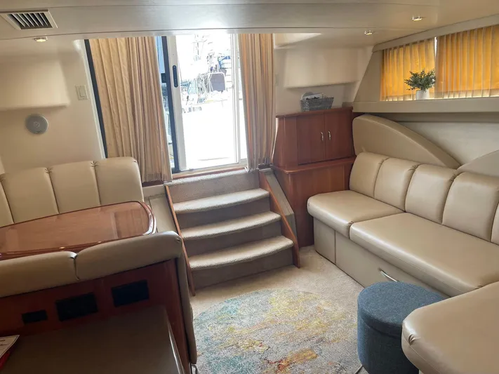 Andiamo Freedom Yacht Photos Pics Interior of 2006 Carver 36 Mariner yacht with beige seating and wooden accents.