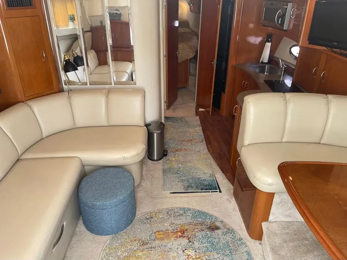 Andiamo Freedom Yacht Photos Pics Luxurious interior of a 2006 Carver 36 Mariner yacht with plush seating and modern amenities.