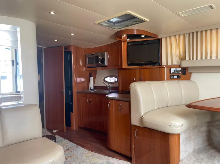 Andiamo Freedom Yacht Photos Pics Interior of 2006 Carver 36 Mariner yacht with modern kitchen and seating area.