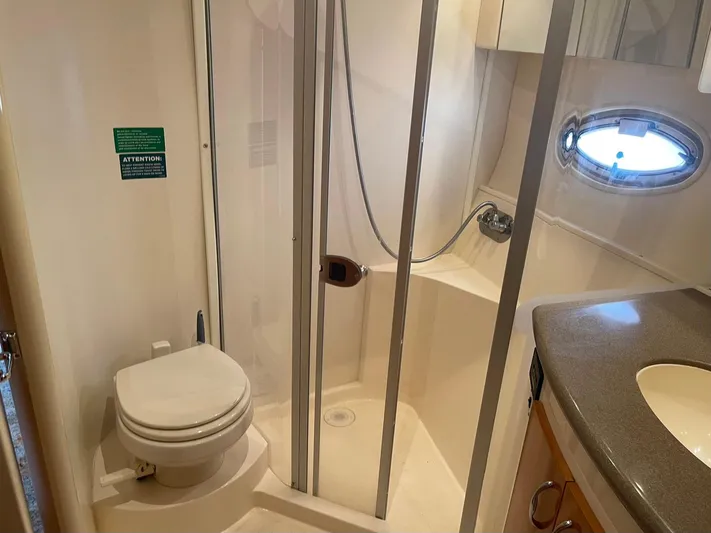 Andiamo Freedom Yacht Photos Pics Bathroom of 2006 Carver 36 Mariner yacht with shower, toilet, and sink.