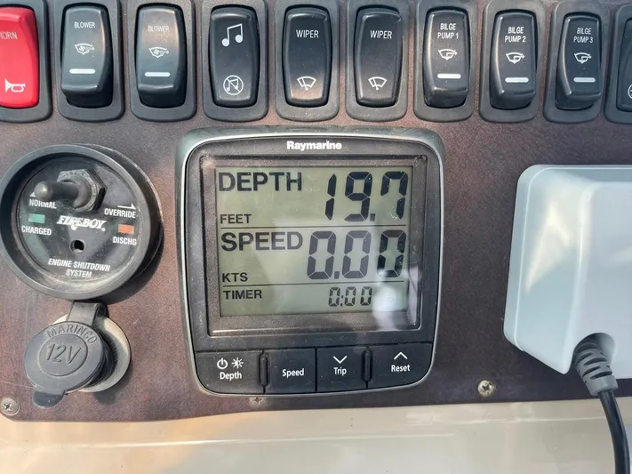 Andiamo Freedom Yacht Photos Pics Control panel of a 2006 Carver 36 Mariner showing depth and speed readings.