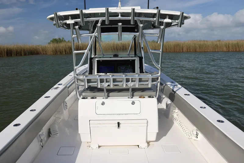  Yacht Photos Pics 2017 Contender 39 ST boat on water, featuring sleek design and advanced navigation equipment.