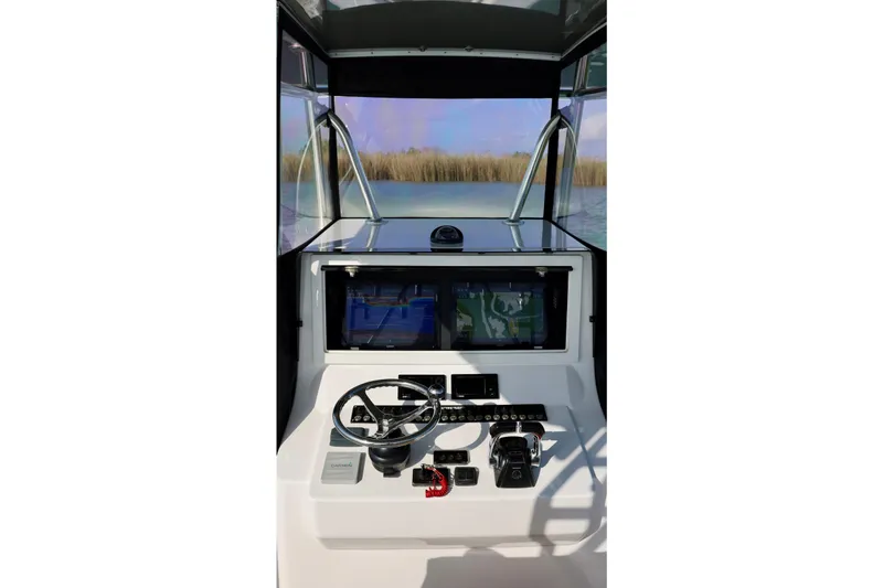  Yacht Photos Pics 2017 Contender 39 ST boat helm with navigation screens and steering wheel.