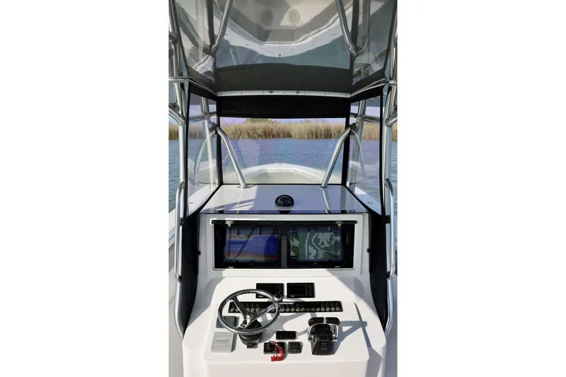  Yacht Photos Pics 2017 Contender 39 ST boat cockpit with steering wheel and navigation system.