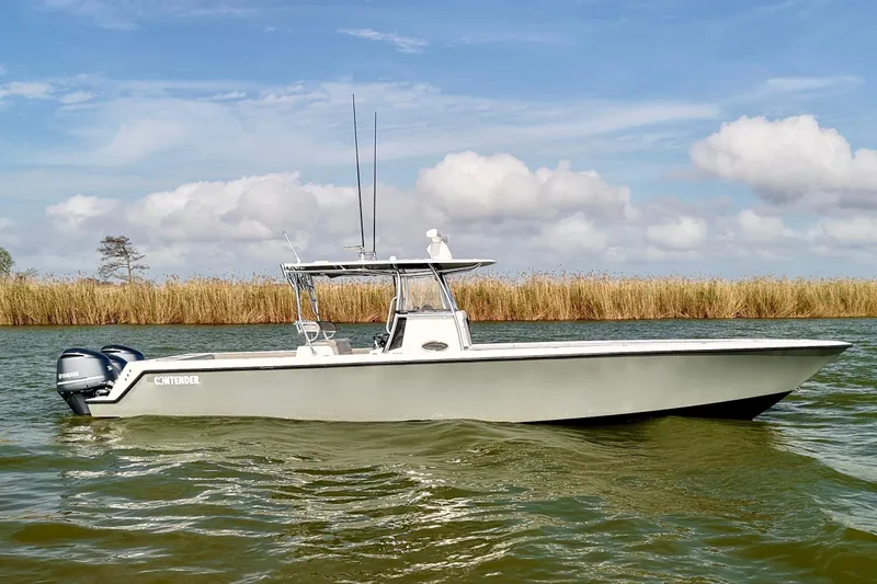  Yacht Photos Pics 2017 Contender 39 ST boat on calm water with clear sky background.