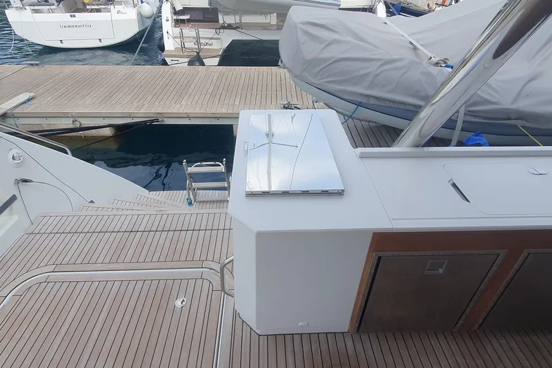  Yacht Photos Pics 2023 Fountaine Pajot Samana 59 yacht deck with sleek design and modern amenities.