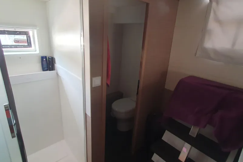  Yacht Photos Pics Bathroom interior of 2023 Fountaine Pajot Samana 59 yacht, featuring modern fixtures and window.