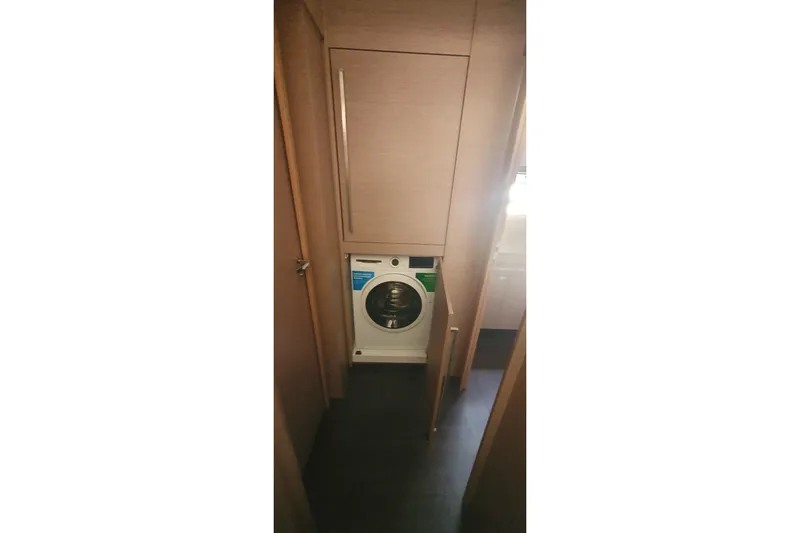  Yacht Photos Pics Laundry area with washing machine inside 2023 Fountaine Pajot Samana 59 yacht.