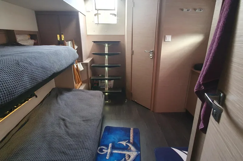 Yacht Photos Pics Interior cabin of 2023 Fountaine Pajot Samana 59 yacht with bunk beds and nautical decor.