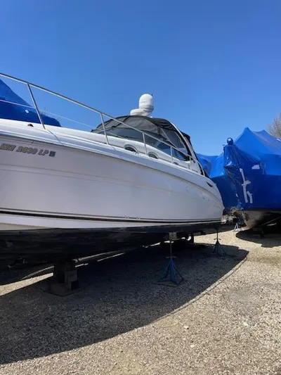  Yacht Photos Pics 2004 Sea Ray 360 Sundancer boat on stands outdoors.
