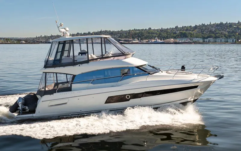 Four At Sea Yacht Photos Pics 2019 Prestige 460 yacht cruising on a calm lake under clear skies.