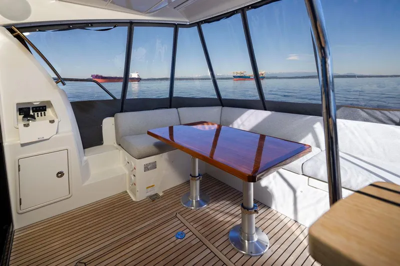 Four At Sea Yacht Photos Pics Luxurious 2019 Prestige 460 yacht interior with elegant seating and ocean view.