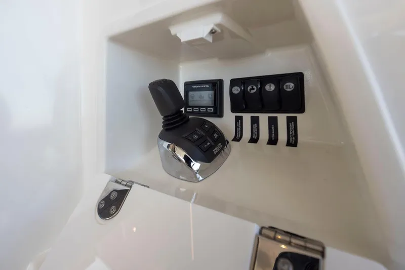 Four At Sea Yacht Photos Pics Control panel of a 2019 Prestige 460 yacht, featuring joystick and switches.