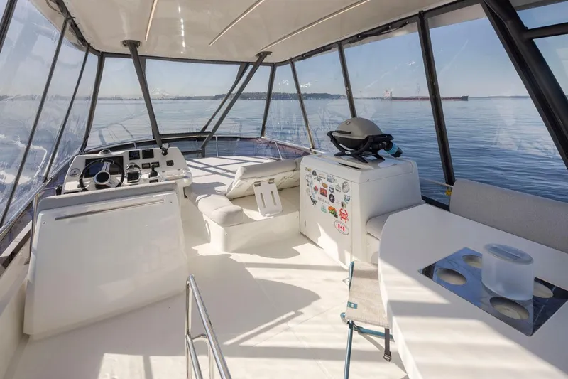 Four At Sea Yacht Photos Pics Luxurious 2019 Prestige 460 yacht interior with helm, seating, and ocean view.