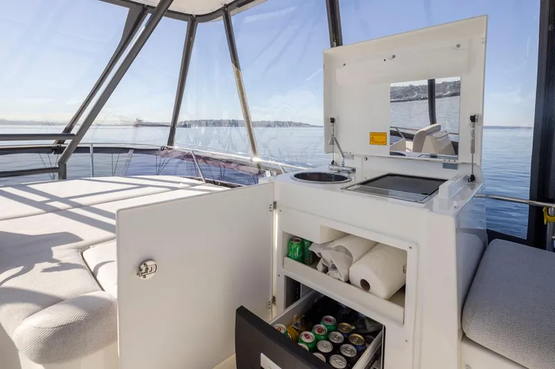 Four At Sea Yacht Photos Pics Luxurious 2019 Prestige 460 yacht interior with kitchenette and panoramic ocean view.