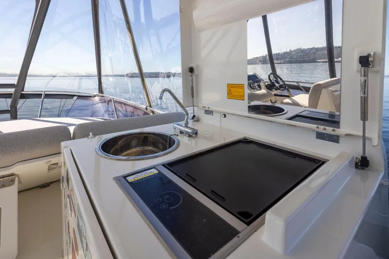 Four At Sea Yacht Photos Pics Prestige 460 yacht interior with kitchenette and scenic water view, 2019 model.