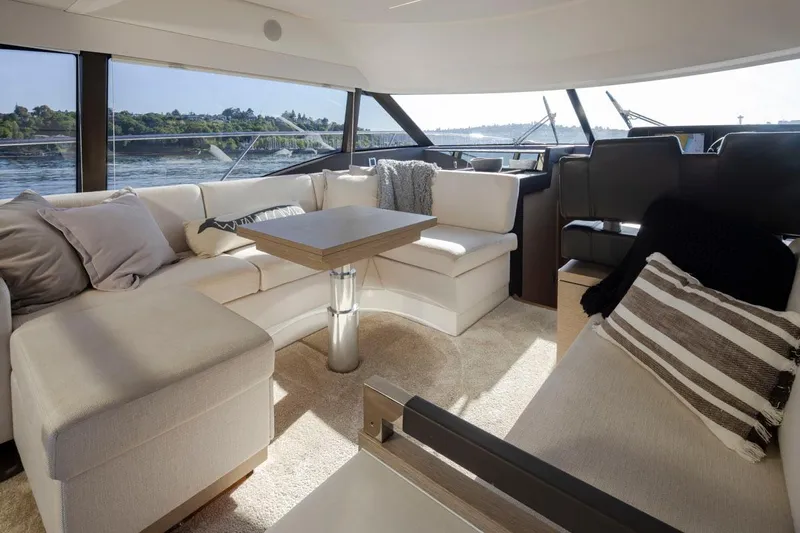 Four At Sea Yacht Photos Pics Luxurious interior of 2019 Prestige 460 yacht with elegant seating and scenic water views.