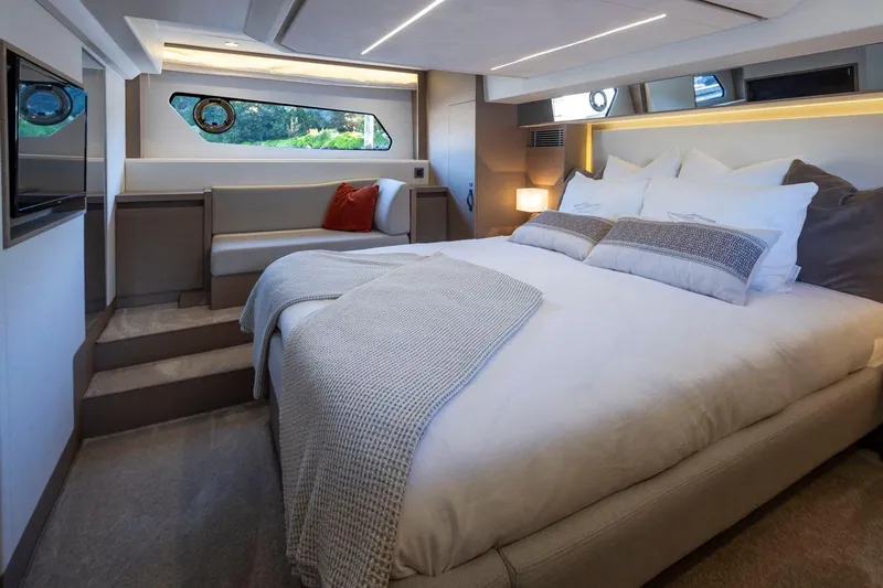 Four At Sea Yacht Photos Pics Luxurious bedroom interior of 2019 Prestige 460 yacht with modern design and cozy bedding.