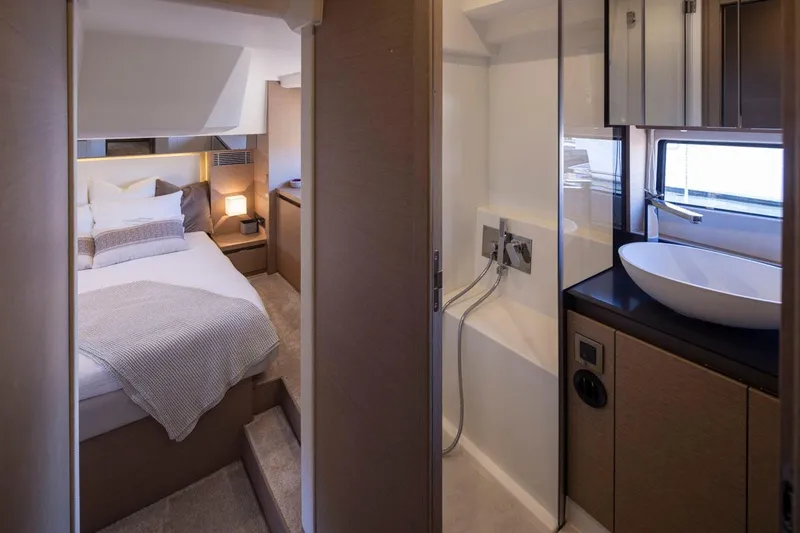 Four At Sea Yacht Photos Pics Luxurious interior of 2019 Prestige 460 yacht featuring bedroom and modern bathroom.