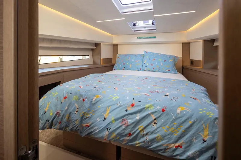 Four At Sea Yacht Photos Pics Luxurious cabin interior of 2019 Prestige 460 yacht with colorful bedding.